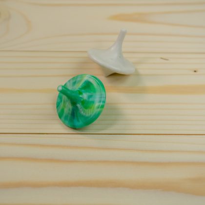 Give Aways from collected and recycled plastic spinning top green white