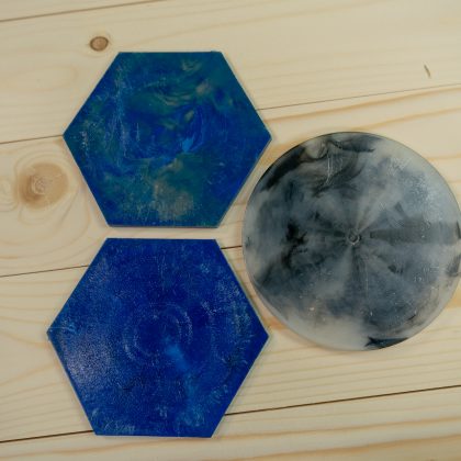 Give Aways from collected and recycled plastic 3 coasters black white blue
